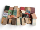 many old books stacked on top of each other
