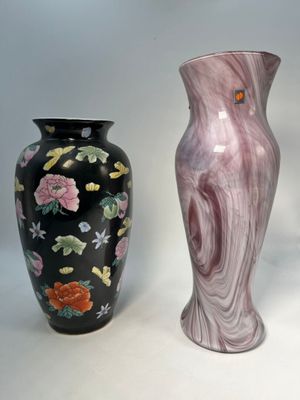 three vases sitting next to each other on a white surface
