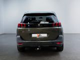 the back end of a small suv parked in a white room