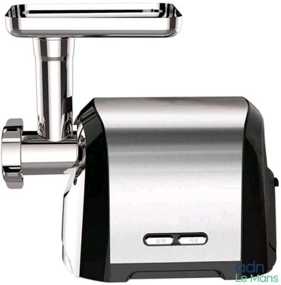 a meat grinder sitting on a white surface