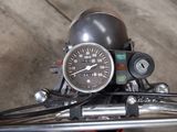 a close up of a motorcycle with a speedometer on it ' s handlebar