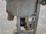 an old machine that is sitting on the street