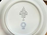 a person holding a plate with a quote on it