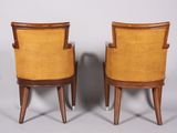 a pair of mid century style chairs with yellow upholstered seats