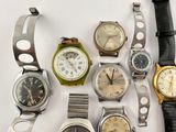 a lot of watches that are sitting on a table