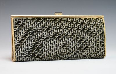 a black and gold clutch bag with a chain design