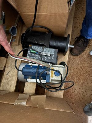 a man that is standing next to a box with a pump