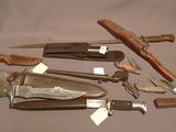 many different types of knives that are on the table