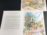 an open book with watercolor illustrations of a town and a street