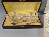 a silverware set in a case with spoons and spoons in it
