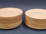 two stacks of plates sitting on a blue surface