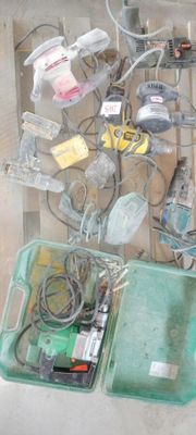 a display of electronic devices and wires on a shelf