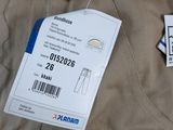 a label on a pair of pants with a price tag