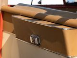 a close up view of a tan and white truck