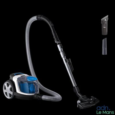 un aspirateur posé sur une surface noire