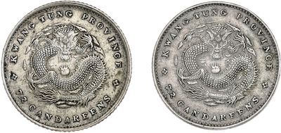 a silver coin with an image of a dragon on it