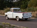 a white truck driving down the road in the country