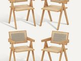 four wooden chairs with a woven seat and back rest