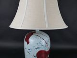 an image of a lamp with a red fish on it