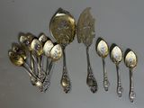 a lot of silver spoons and spoon spoons on a table