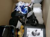 a box full of tennis rackets and other items in it