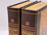 two books that are sitting side by side on a table