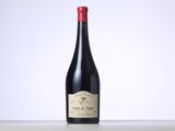 a bottle of wine that is sitting on a table