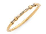 un bracelet rigide en or jaune serti de diamants