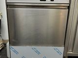 a stainless steel dishwasher sitting on top of a counter