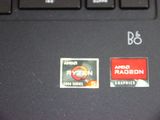 a close up of a computer keyboard with stickers on it