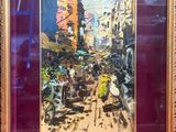 tableau encadré représentant une scène de rue avec des passants marchant dans la rue