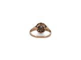 a close up of a gold ring with a brown and white diamond