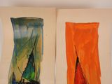 two pieces of art that are on the wall