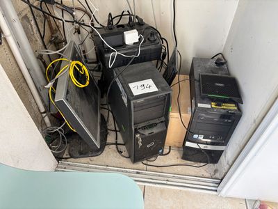 a lot of computer equipment that are sitting on the floor