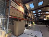 a large warehouse with a lot of boxes on the shelves