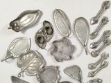 a lot of silver spoons and spoon spoons on a white surface