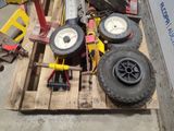 a pallet with a bunch of tires and a wheel