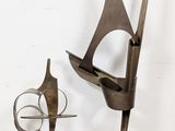 a sculpture of a sailboat and a sculpture of a bird on a stand