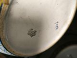 a close up of a vase with a blue and white design