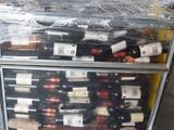 many bottles of wine on a cart in the garage