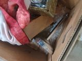 a box with a clock inside of it on the floor