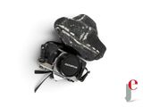 a camera and a hat on a white surface