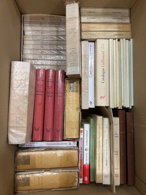 a box full of books that are sitting on the floor