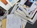 a pile of books on a table with a bunch of them