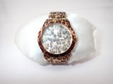 a watch that is sitting on top of a shell