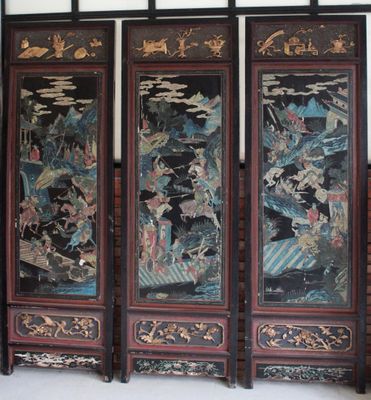 four paneled screen with oriental painting on it in a room