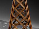 an old wooden wine rack with a lattice design on it