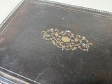 a black box with a gold design on it