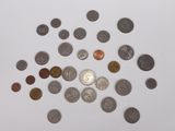 a lot of coins that are on the table