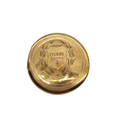 a close up of a gold plate on a white background
